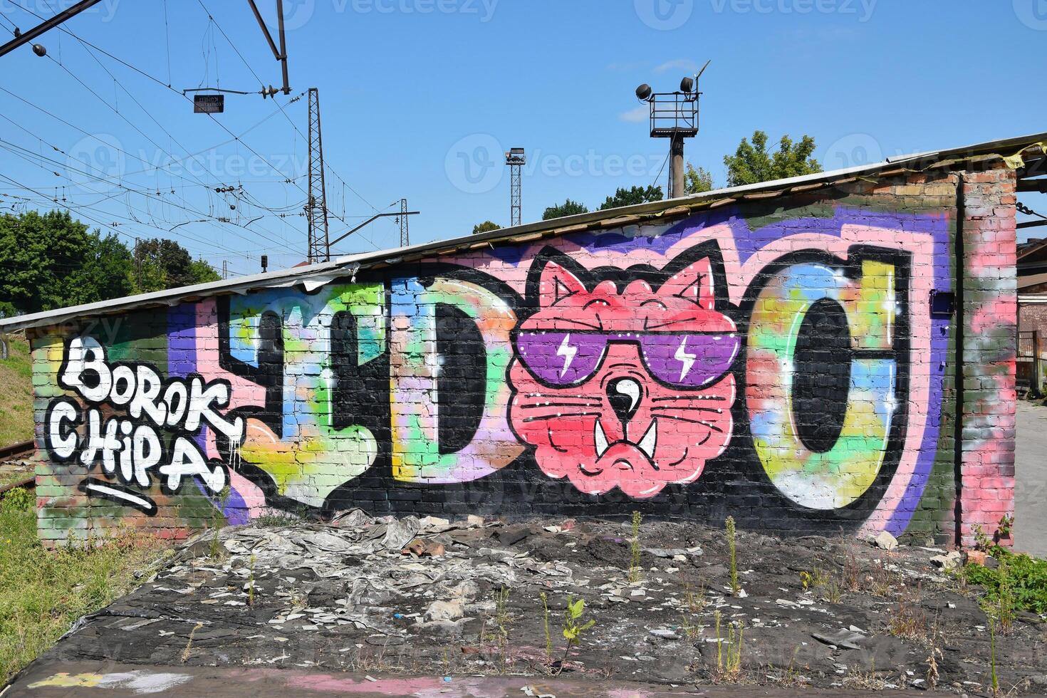 Colorful background of graffiti painting artwork with bright aerosol outlines on wall. Old school street art piece made with aerosol spray paint cans. Contemporary youth culture photo