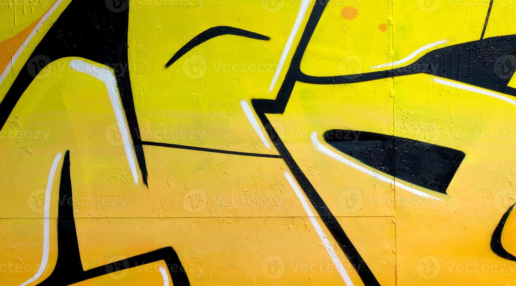 Colorful background of graffiti painting artwork with bright aerosol outlines on wall. Old school street art piece made with aerosol spray paint cans. Contemporary youth culture photo