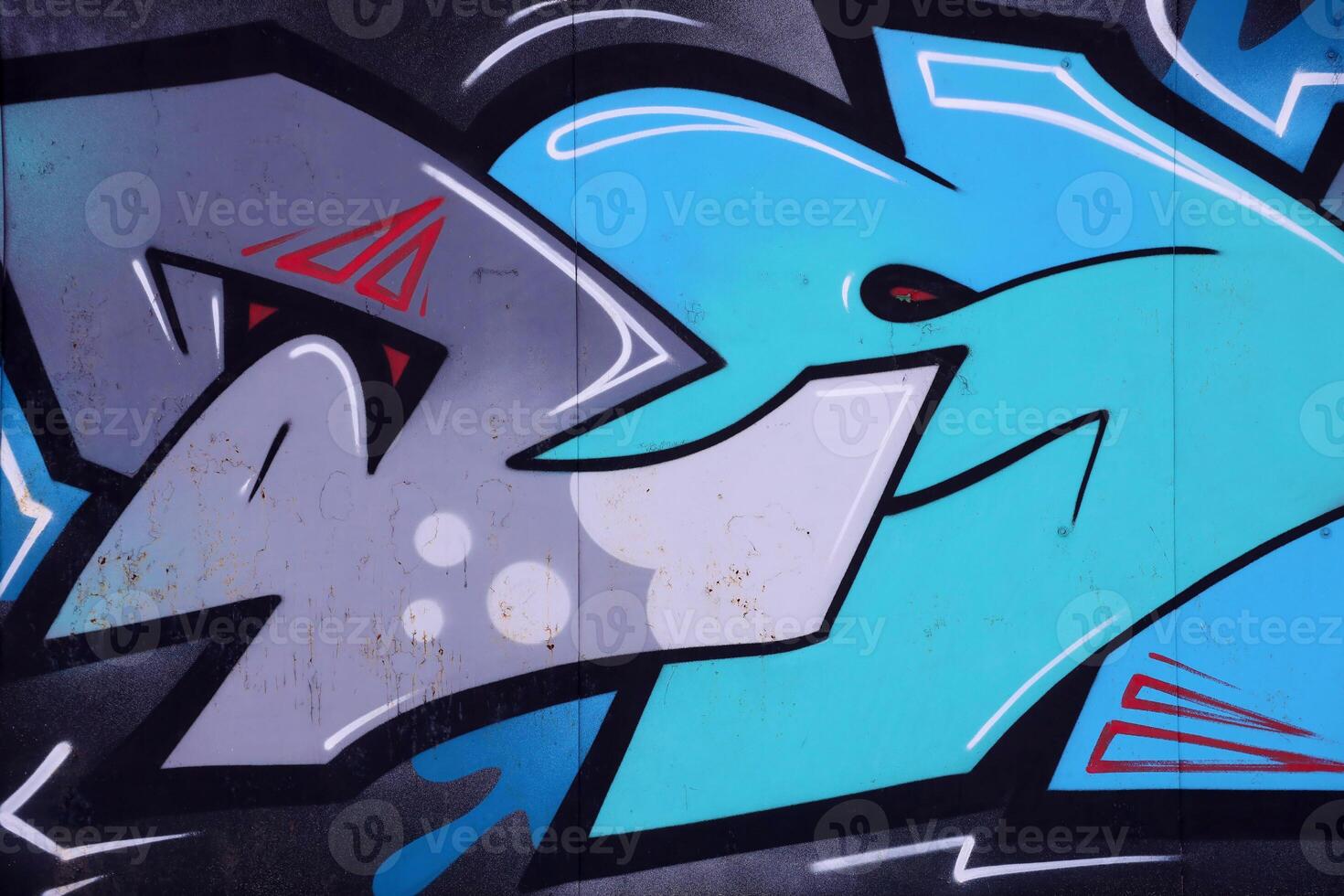 Colorful background of graffiti painting artwork with bright aerosol outlines on wall. Old school street art piece made with aerosol spray paint cans. Contemporary youth culture photo