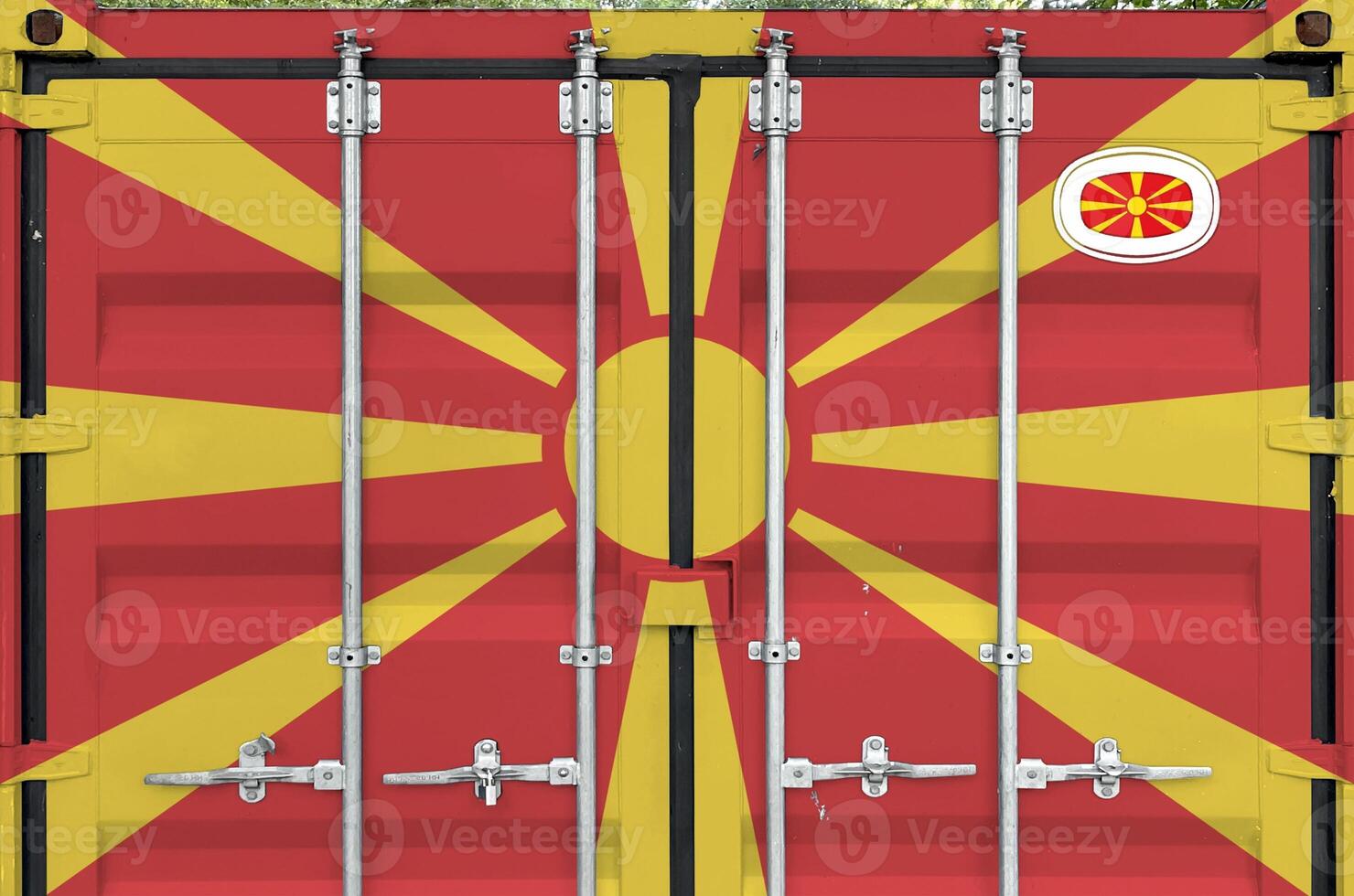 Macedonia flag depicted on metal doors of shipping cargo container outdoors in docks area photo