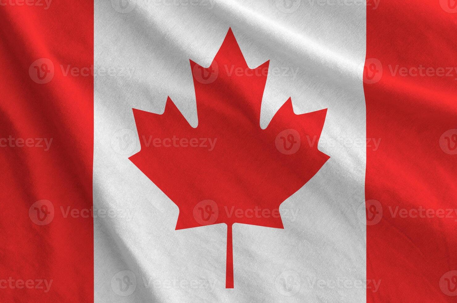 Canada flag depicted on folded wavy fabric of old cloth photo