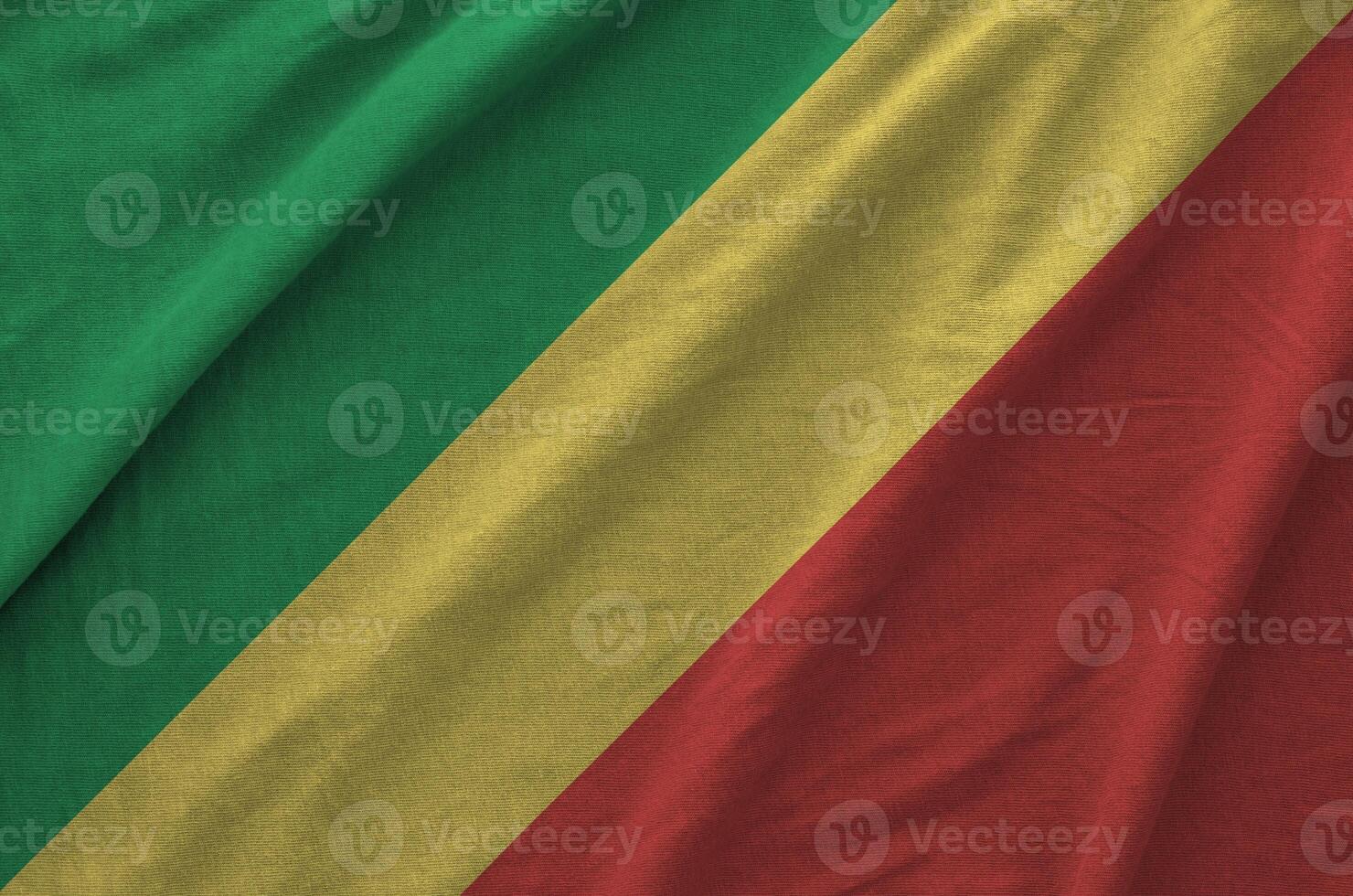 Congo flag depicted on folded wavy fabric of old cloth photo