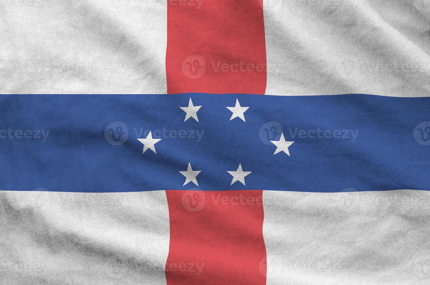 Netherlands Antilles flag depicted on folded wavy fabric of old cloth photo