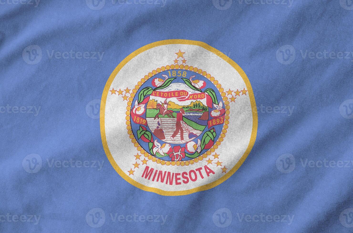 Minnesota US state flag depicted on folded wavy fabric of old cloth photo