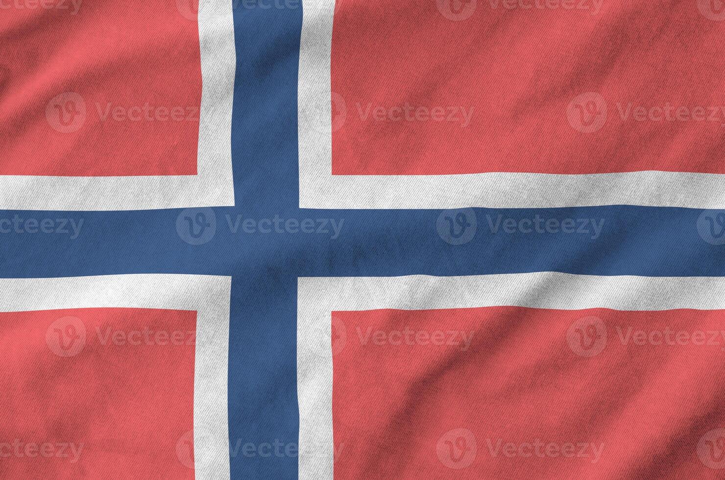 Norway flag depicted on folded wavy fabric of old cloth photo