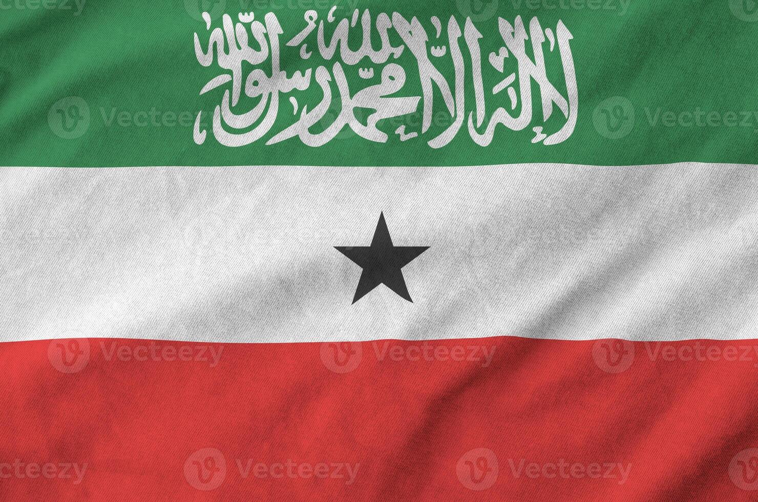 Somaliland flag depicted on folded wavy fabric of old cloth photo