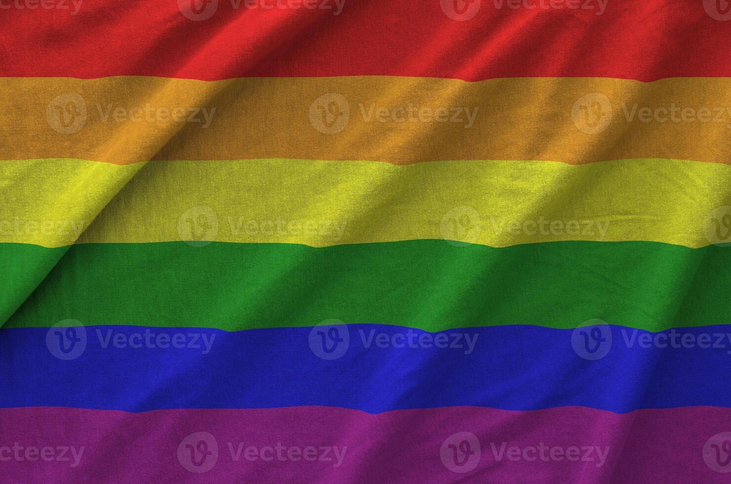 LGBT community flag depicted on folded wavy fabric of old cloth photo