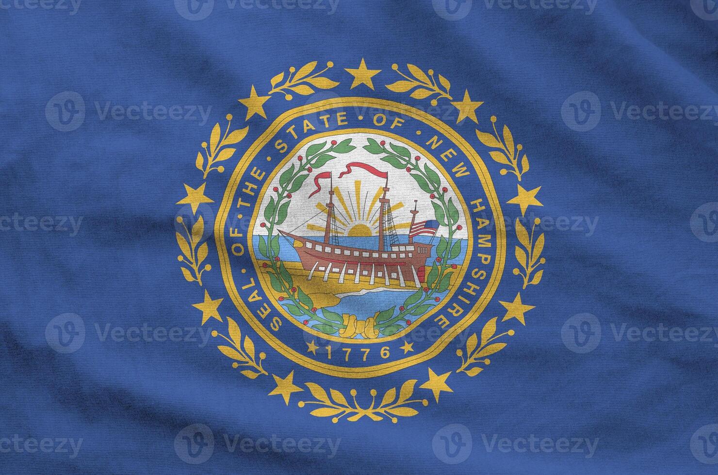 New Hampshire US state flag depicted on folded wavy fabric of old cloth photo
