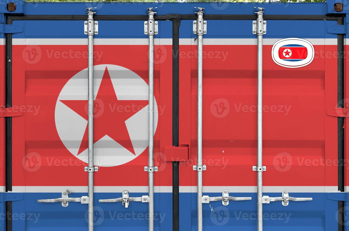 North Korea flag depicted on metal doors of shipping cargo container outdoors in docks area photo