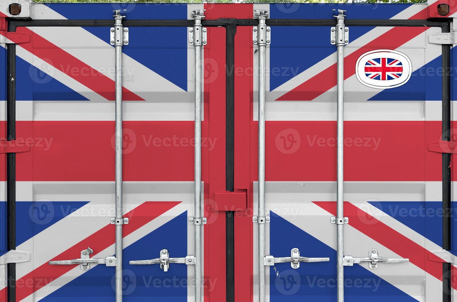 Great britain flag depicted on metal doors of shipping cargo container outdoors in docks area photo