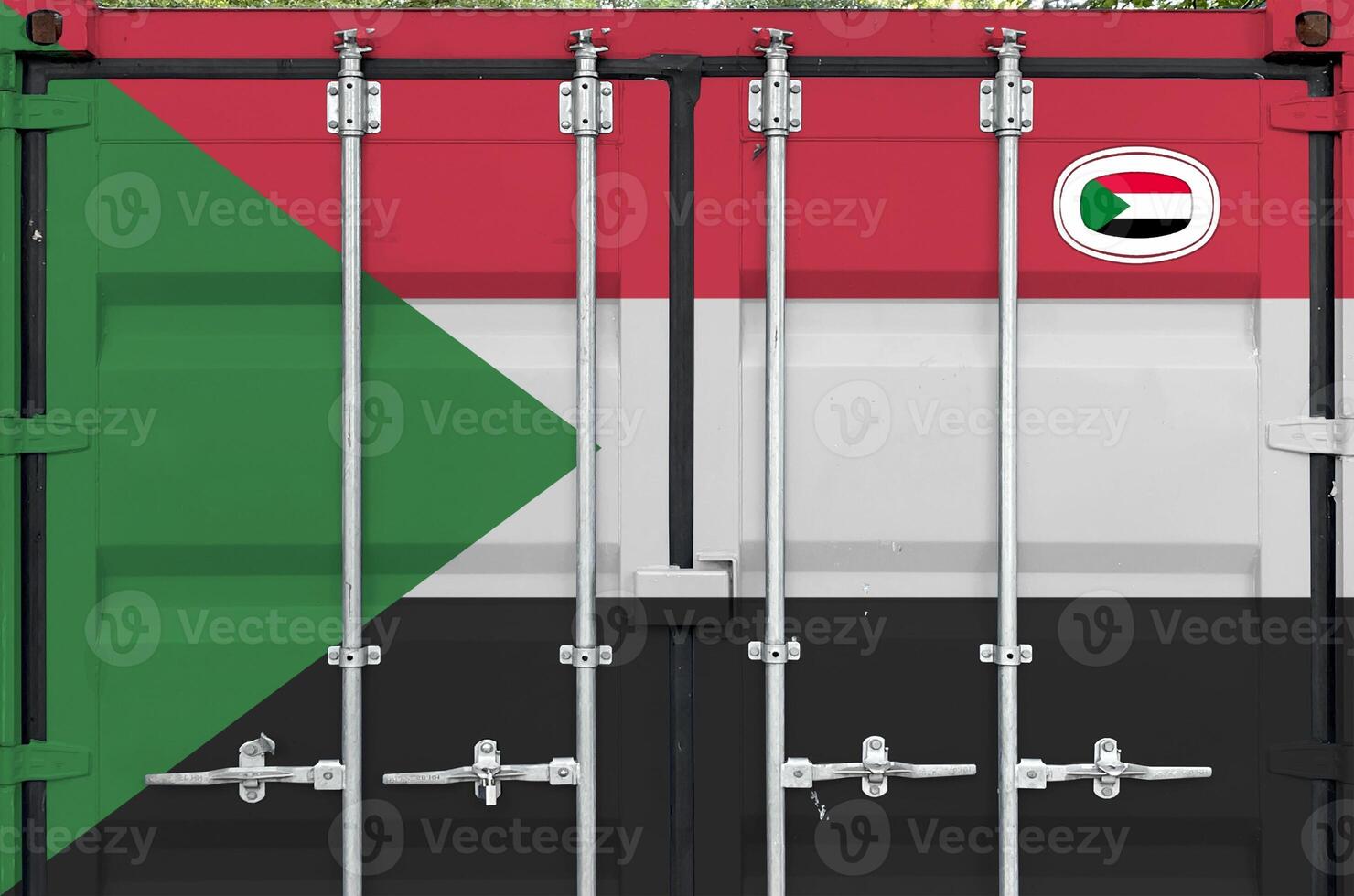 Sudan flag depicted on metal doors of shipping cargo container outdoors in docks area photo
