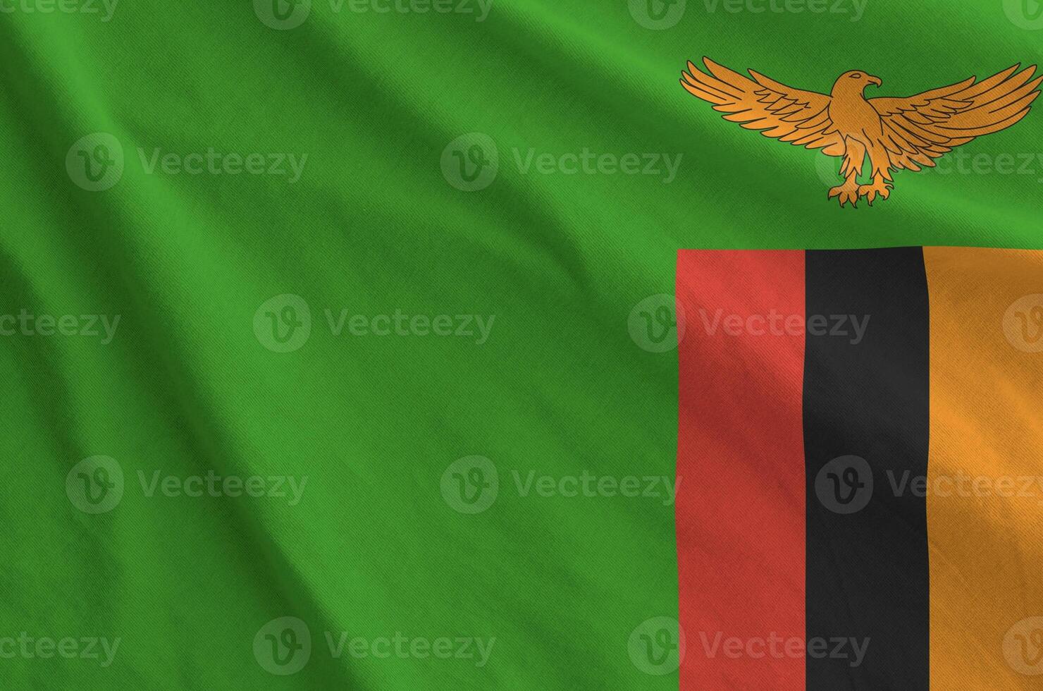 Zambia flag depicted on folded wavy fabric of old cloth photo