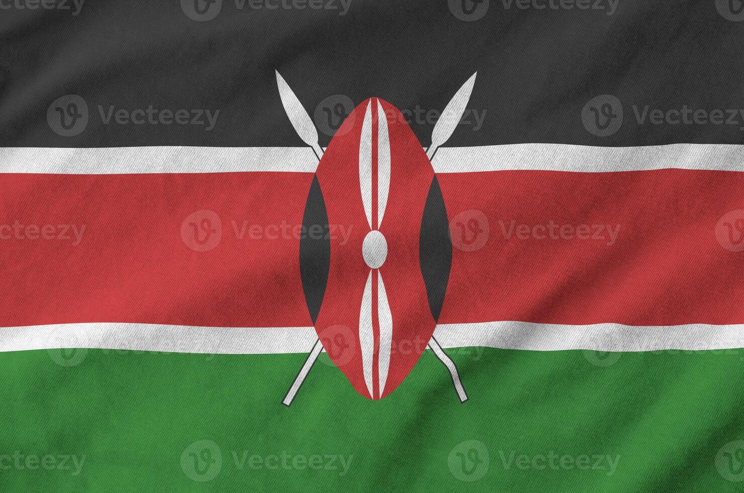 Kenya flag depicted on folded wavy fabric of old cloth photo