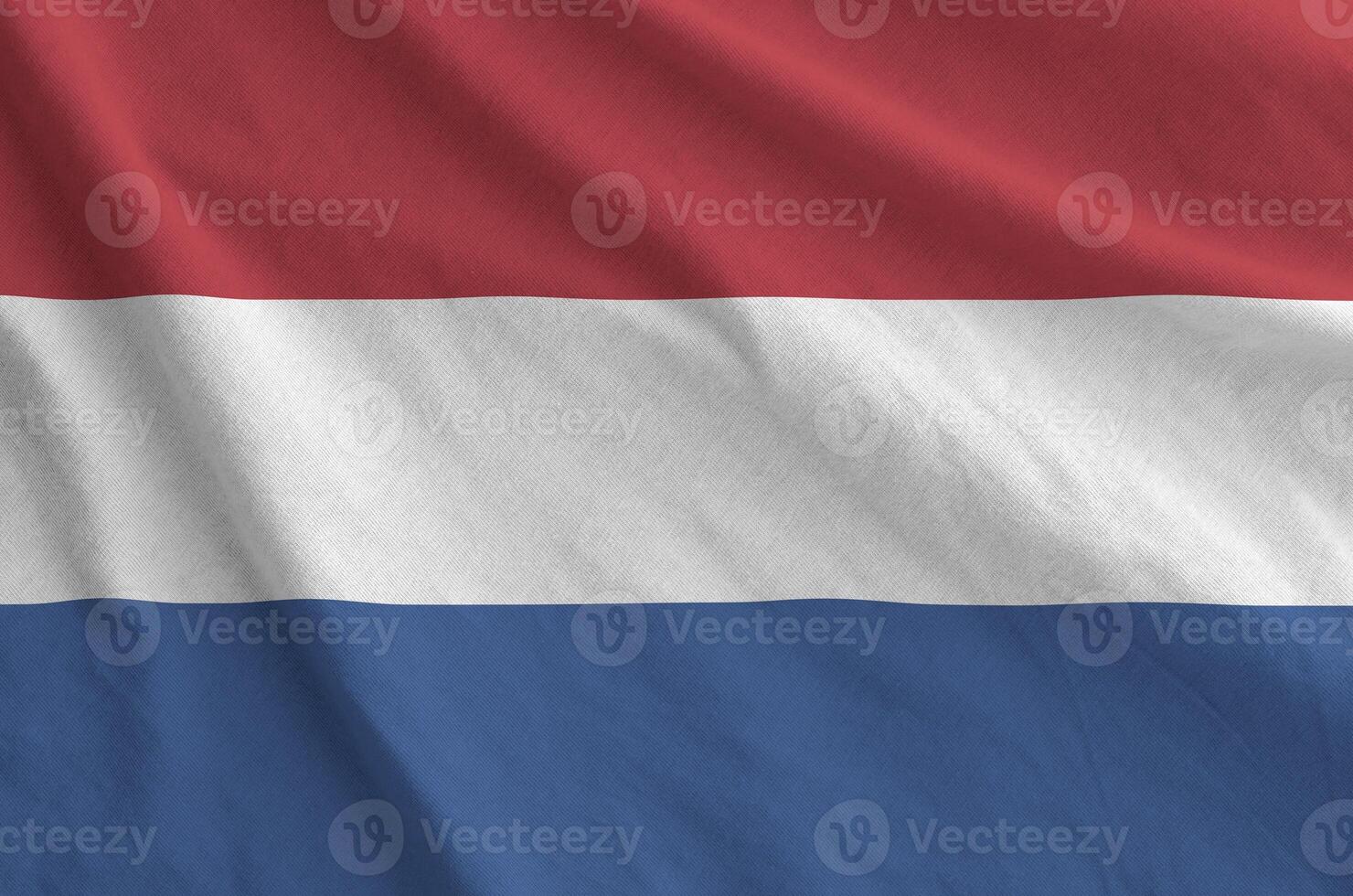 Netherlands flag depicted on folded wavy fabric of old cloth photo