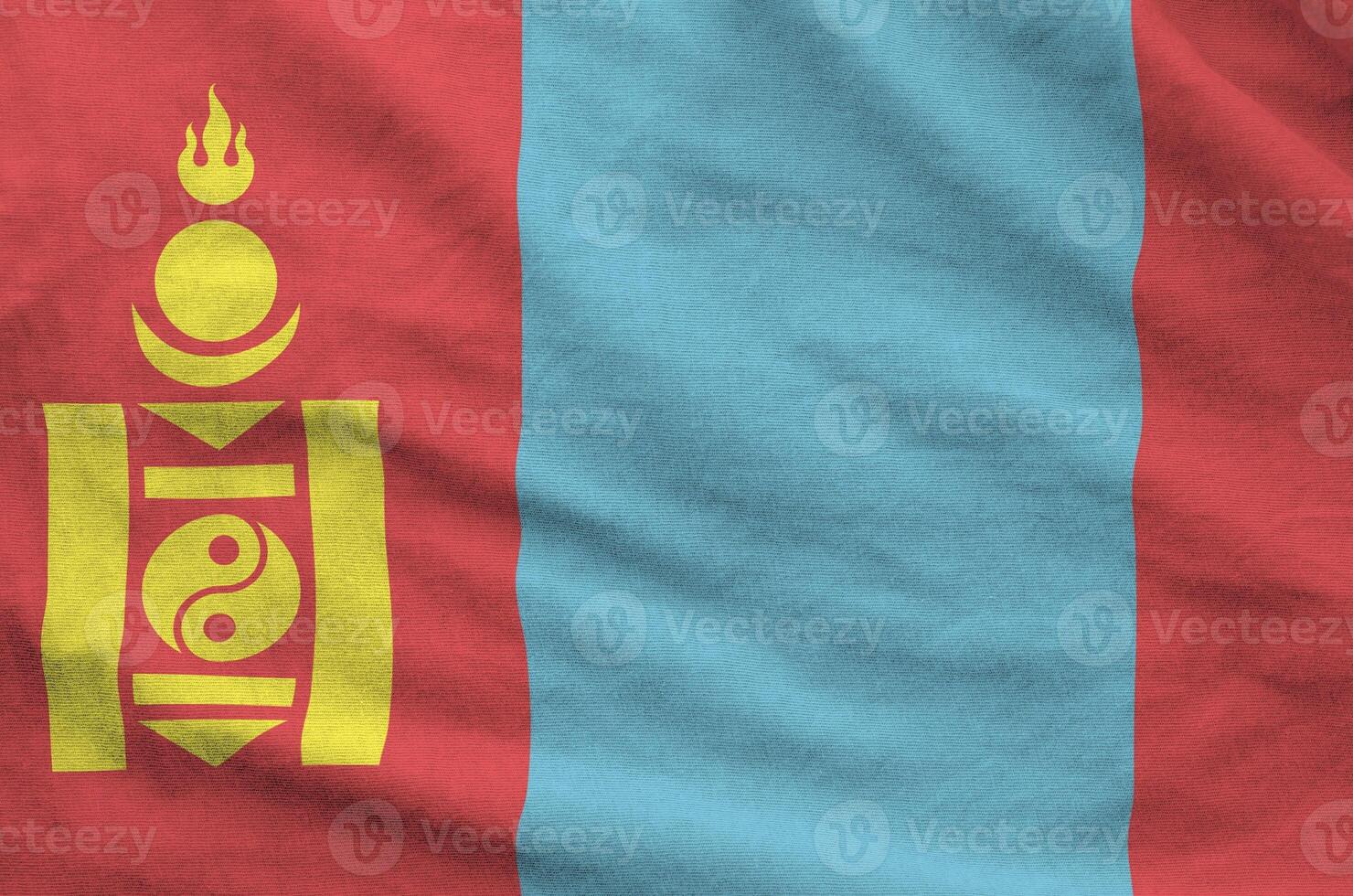 Mongolia flag depicted on folded wavy fabric of old cloth photo