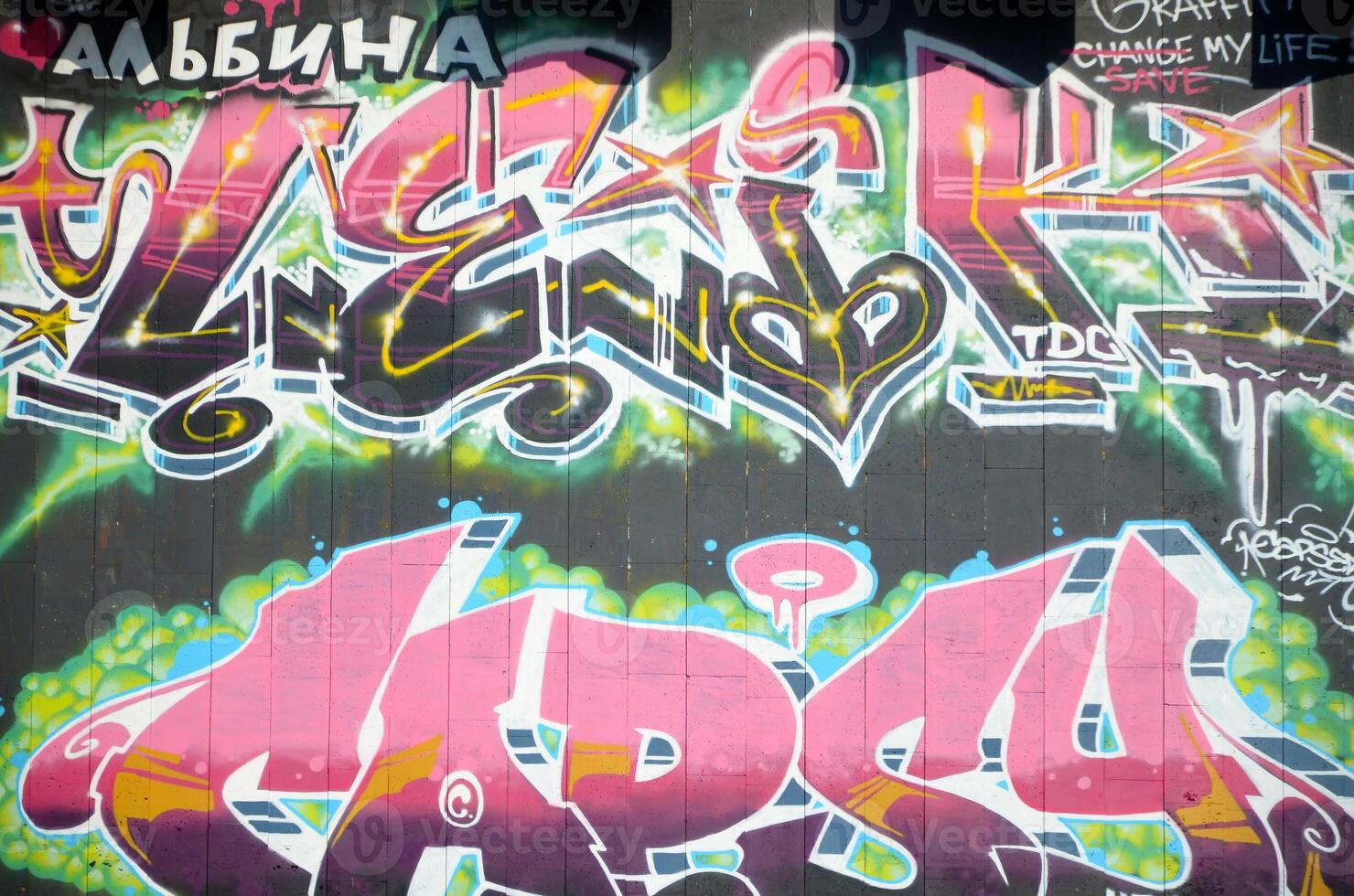 Colorful background of graffiti painting artwork with bright aerosol outlines on wall. Old school street art piece made with aerosol spray paint cans. Contemporary youth culture photo