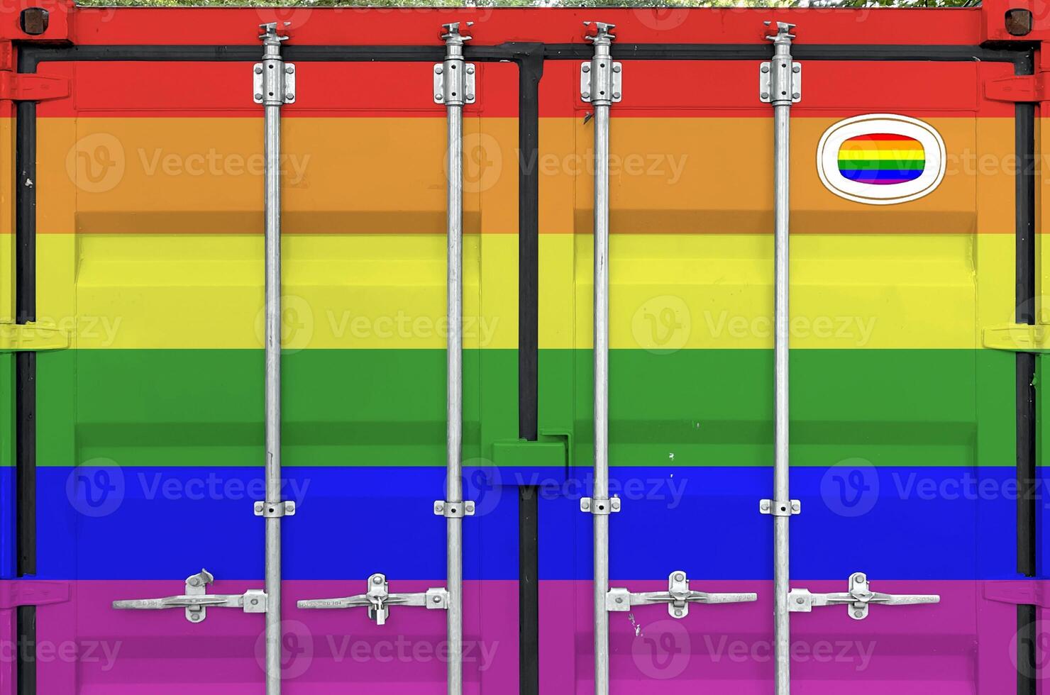 LGBT community flag depicted on metal doors of shipping cargo container outdoors in docks area photo