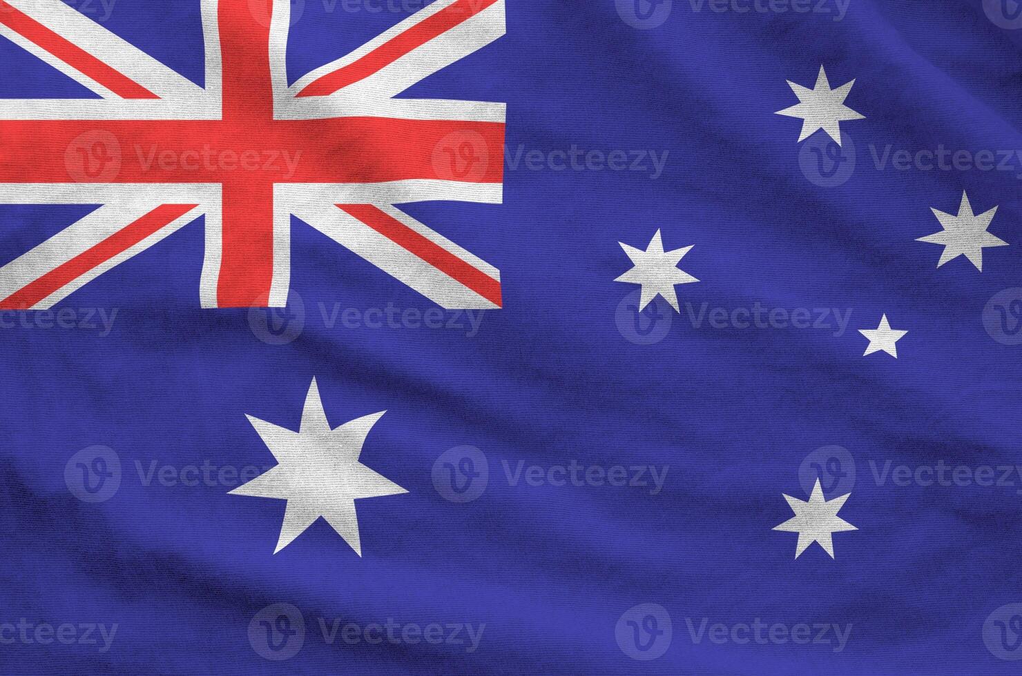 Australia flag depicted on folded wavy fabric of old cloth photo