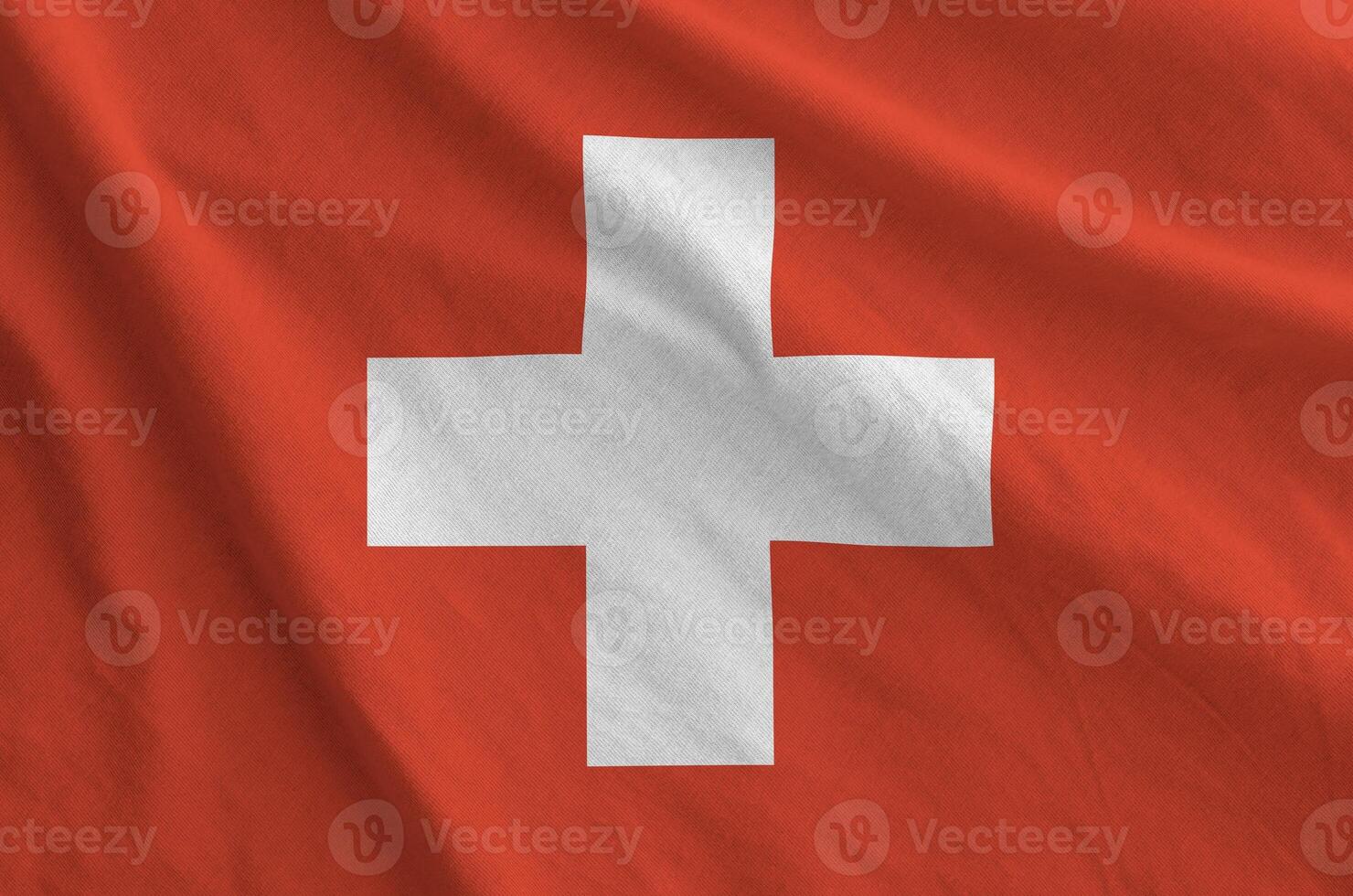 Switzerland flag depicted on folded wavy fabric of old cloth photo
