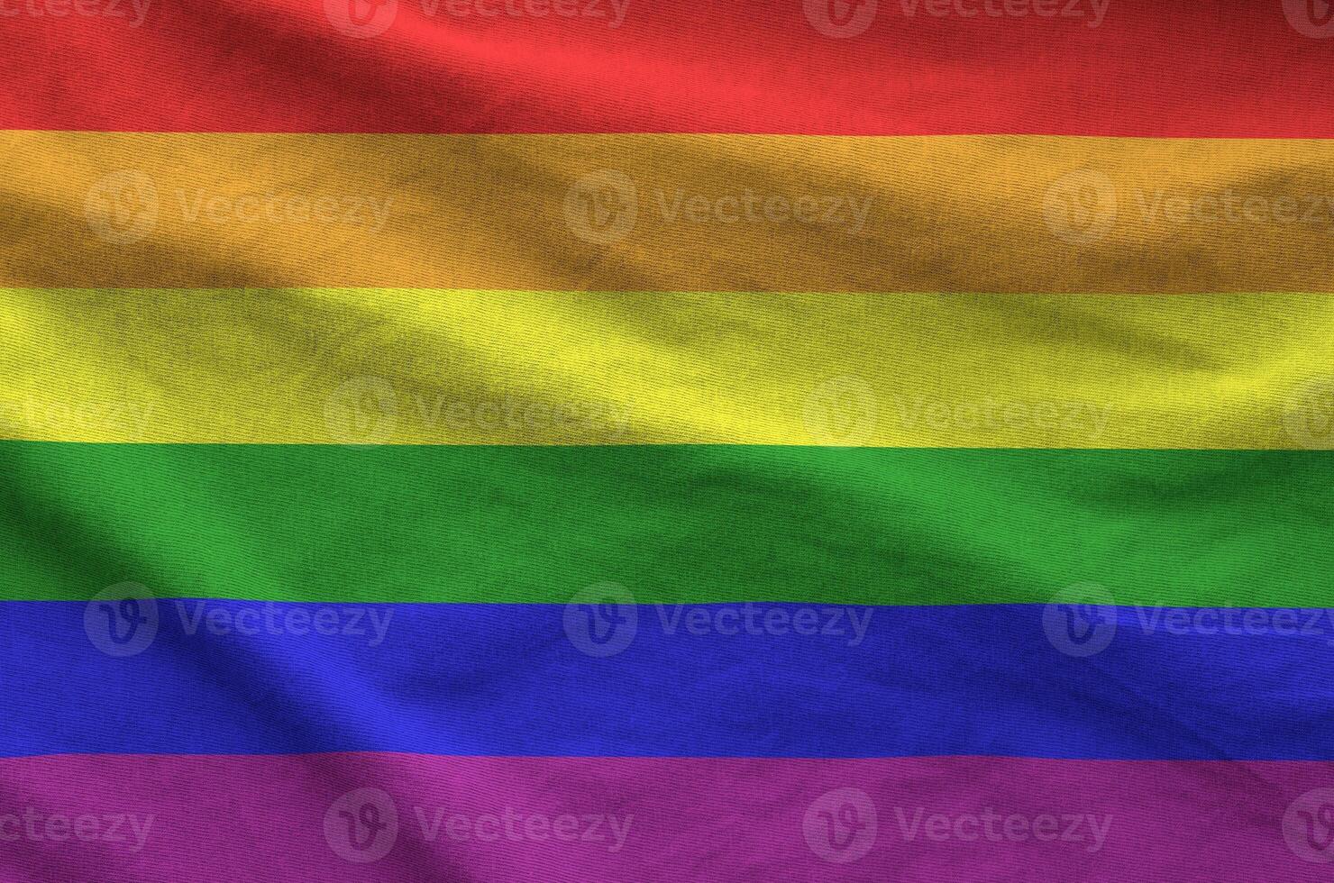 LGBT community flag depicted on folded wavy fabric of old cloth photo