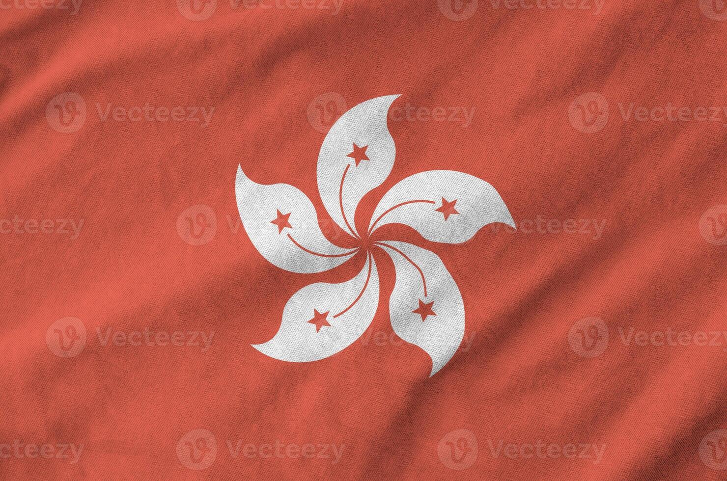Hong kong flag depicted on folded wavy fabric of old cloth photo