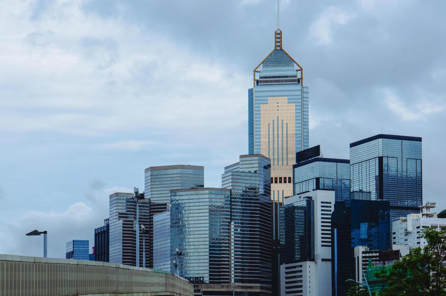 Tall buildings and cloudy sky in a city photo
