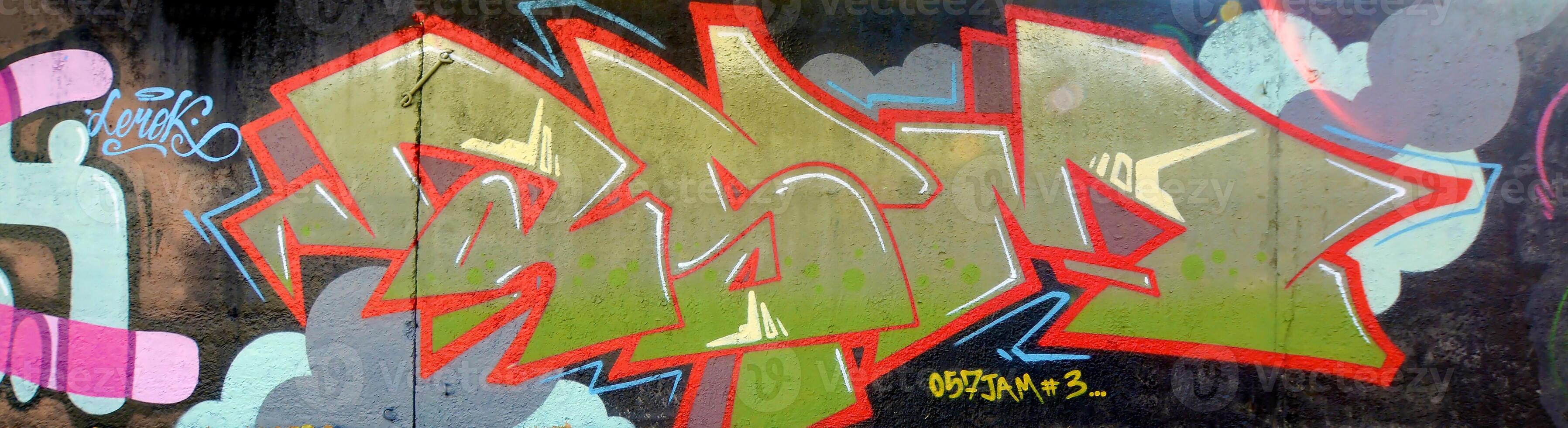 Colorful background of graffiti painting artwork with bright aerosol outlines on wall. Old school street art piece made with aerosol spray paint cans. Contemporary youth culture photo