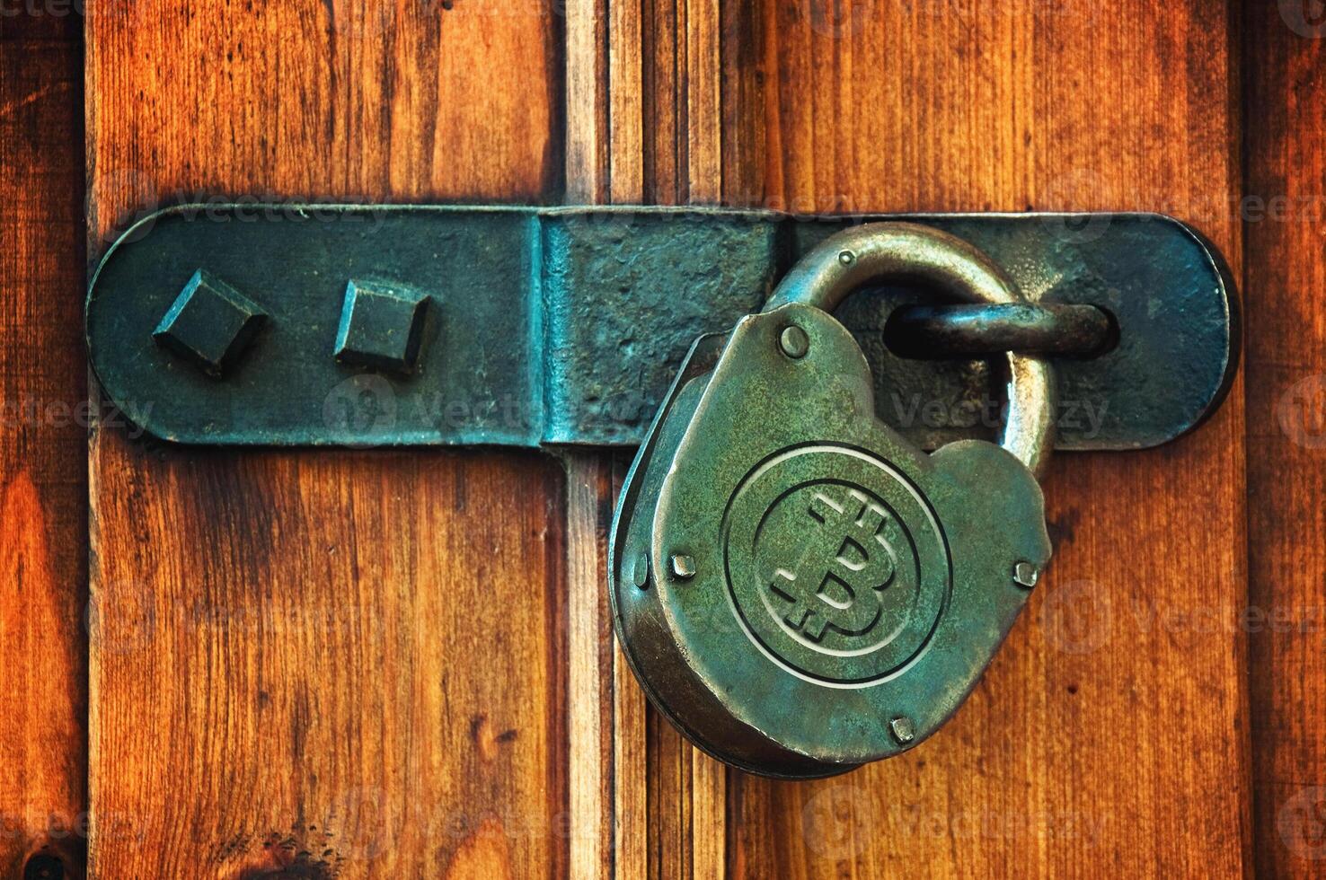 Bitcoins on padlock photo