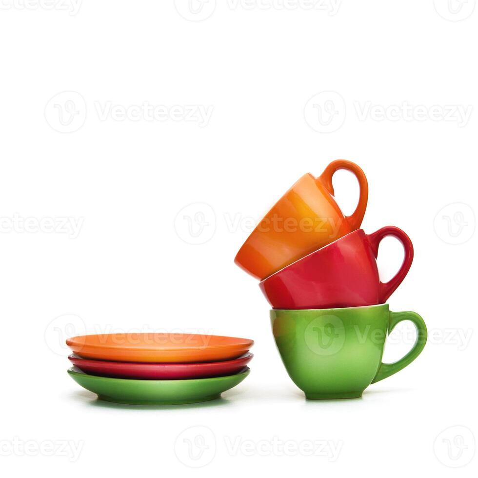 Colorful empty mugs over white background photo