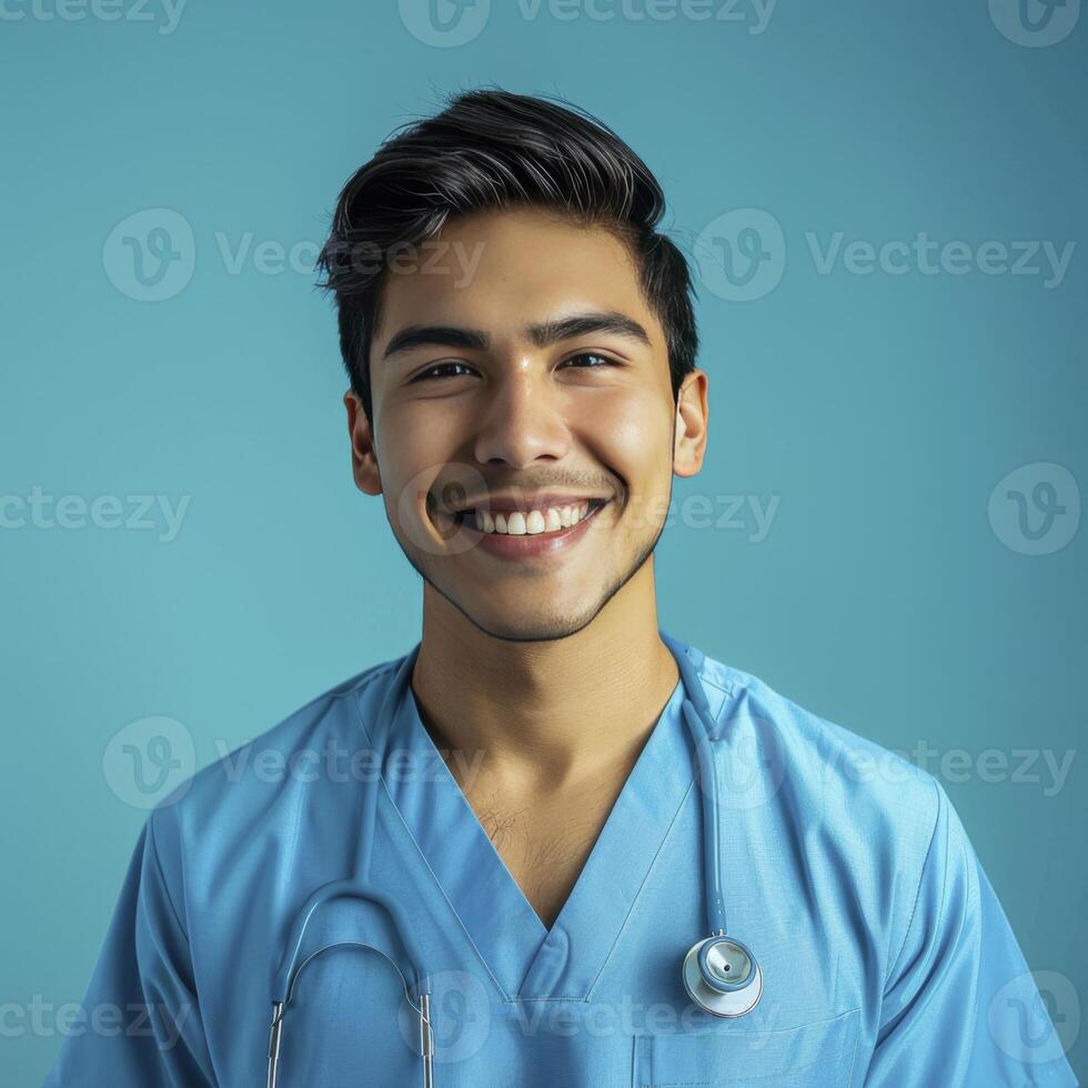 A Attractive Smiling Asian Male Doctor Against Blue Background photo