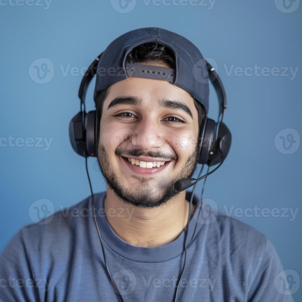 Smiling Call Center Agent with Headset Against a Blue Background photo