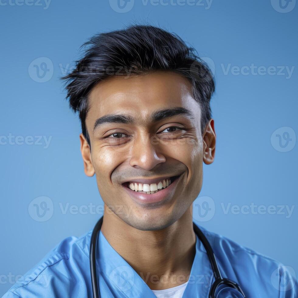 A Attractive Smiling Asian Male Doctor Against Blue Background photo