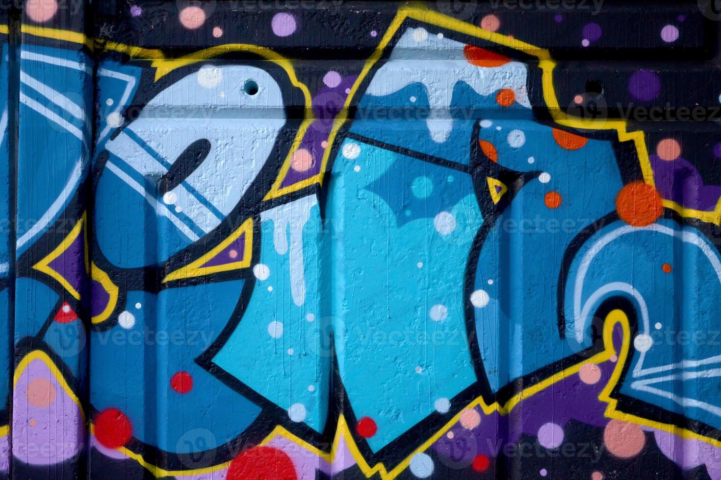 Colorful background of graffiti painting artwork with bright aerosol outlines on wall. Old school street art piece made with aerosol spray paint cans. Contemporary youth culture photo