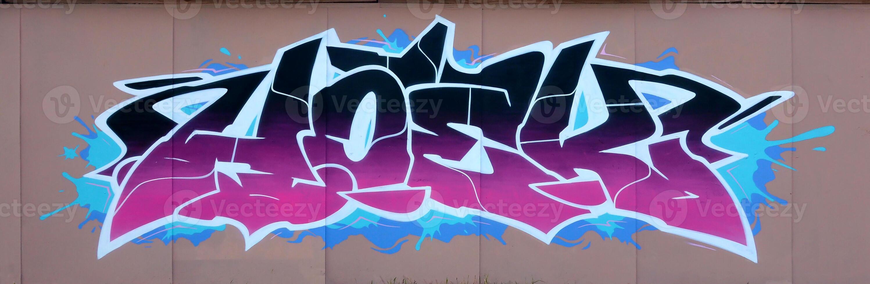 Colorful background of graffiti painting artwork with bright aerosol outlines on wall. Old school street art piece made with aerosol spray paint cans. Contemporary youth culture photo