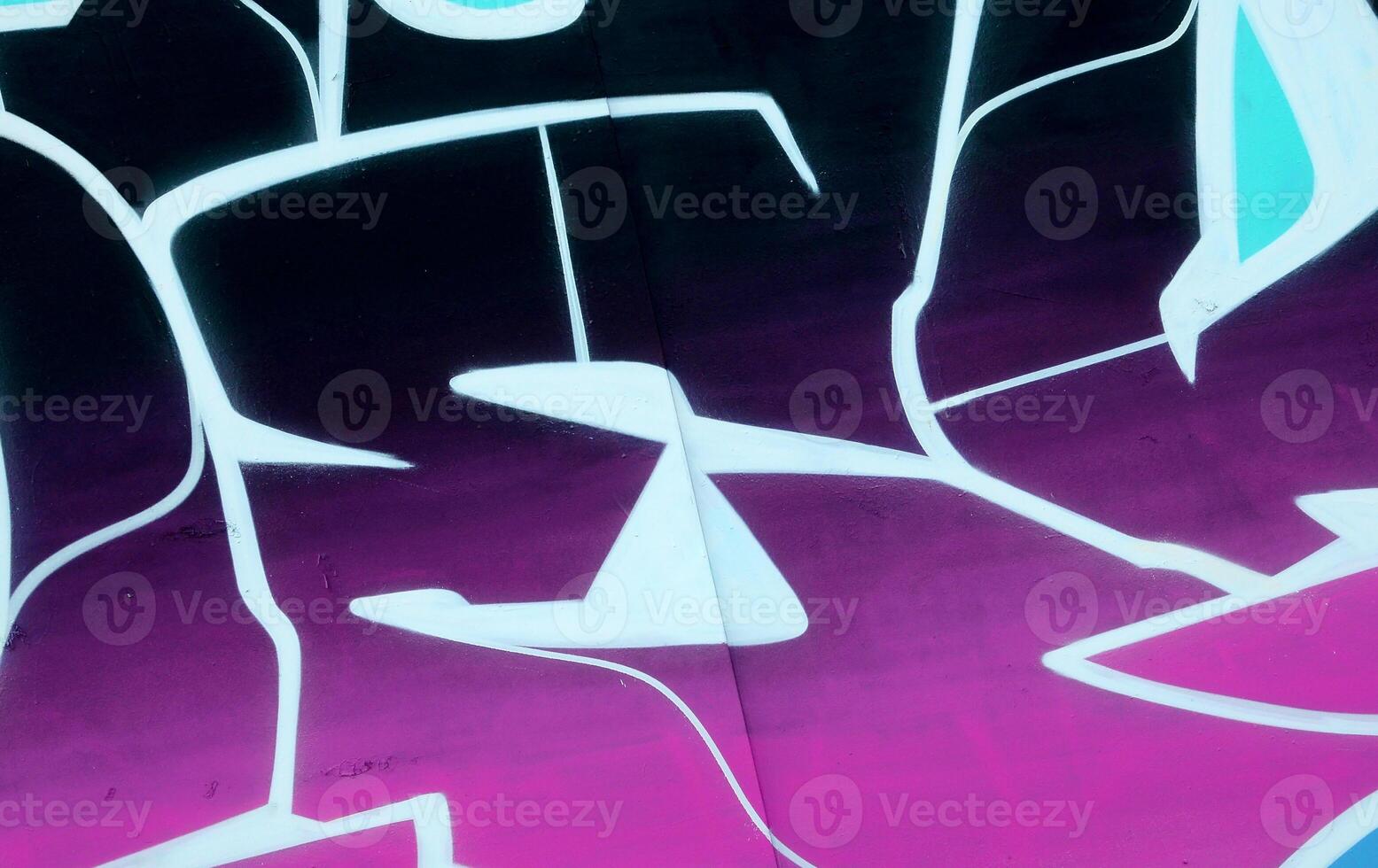 Colorful background of graffiti painting artwork with bright aerosol outlines on wall. Old school street art piece made with aerosol spray paint cans. Contemporary youth culture photo