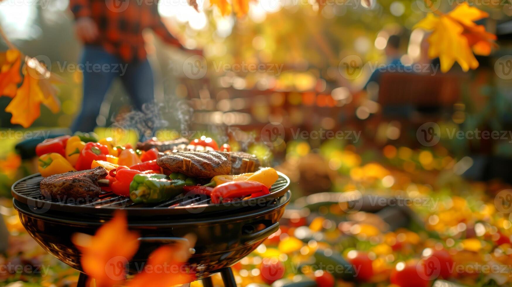 Outdoor barbecue gathering with diverse group of friends enjoying grilled meats and vegetables in an autumn park. Concept of fall picnic, socializing, outdoor cooking, and friendship photo