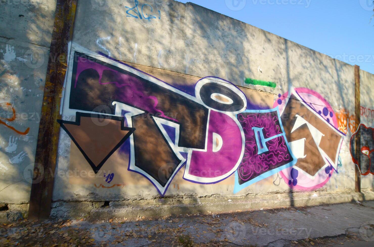 Colorful background of graffiti painting artwork with bright aerosol outlines on wall. Old school street art piece made with aerosol spray paint cans. Contemporary youth culture photo