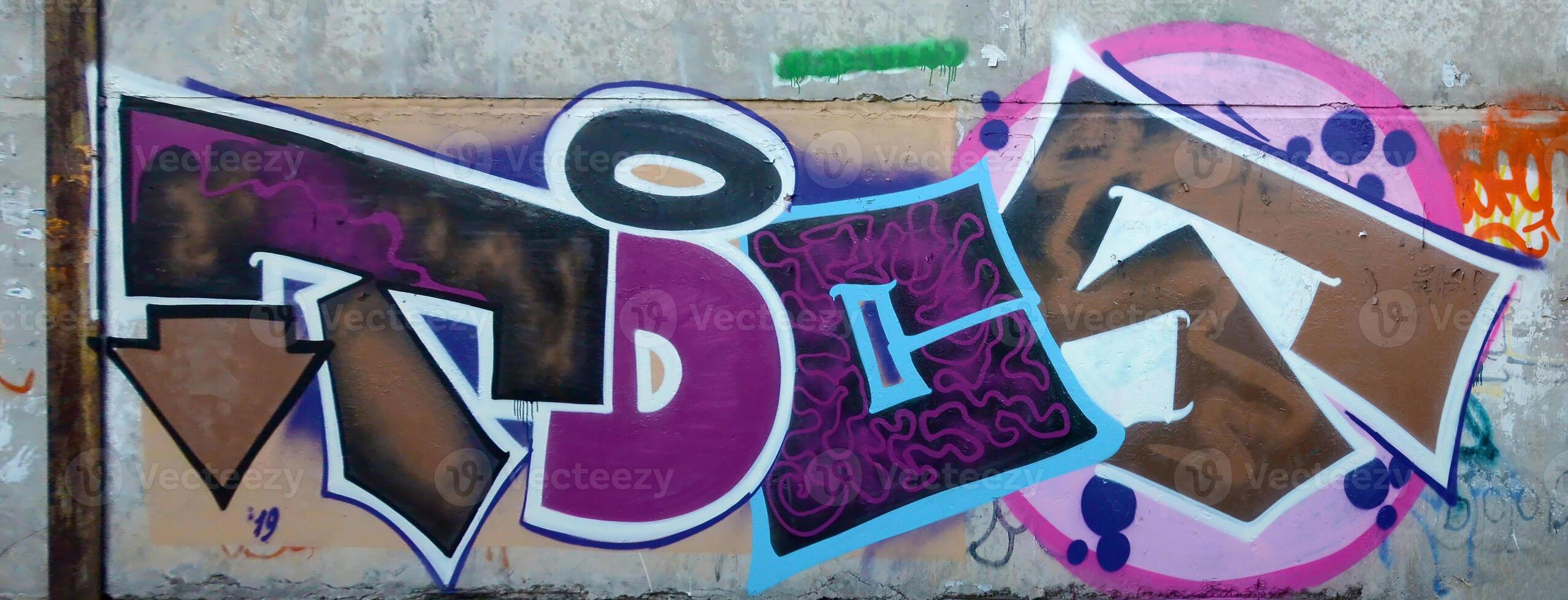 Colorful background of graffiti painting artwork with bright aerosol outlines on wall. Old school street art piece made with aerosol spray paint cans. Contemporary youth culture photo