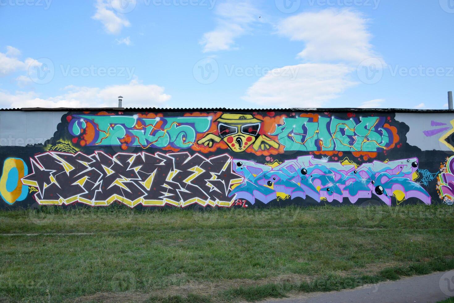 Colorful background of graffiti painting artwork with bright aerosol outlines on wall. Old school street art piece made with aerosol spray paint cans. Contemporary youth culture photo