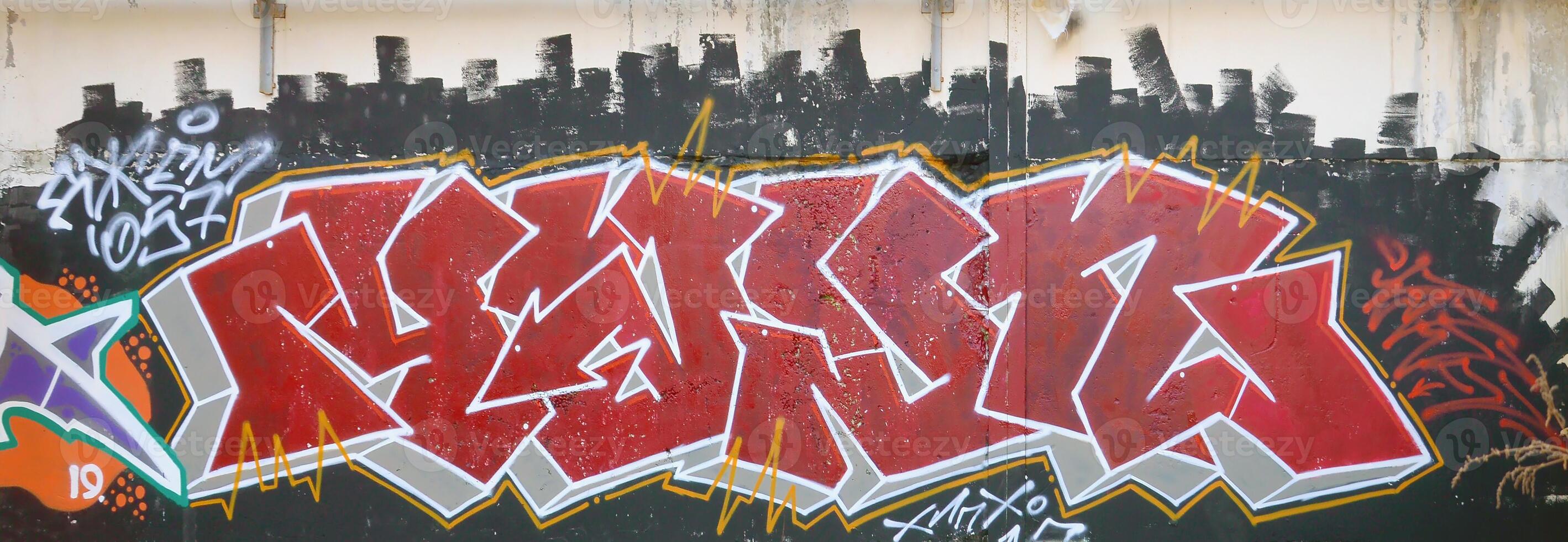 Colorful background of graffiti painting artwork with bright aerosol outlines on wall. Old school street art piece made with aerosol spray paint cans. Contemporary youth culture photo