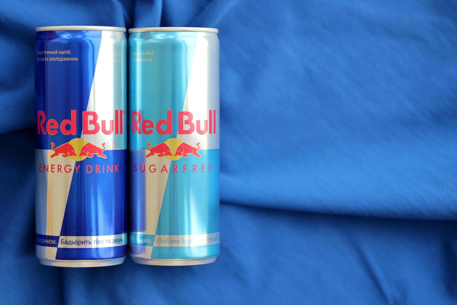 TERNOPIL, UKRAINE - JULY 7, 2023 Red Bull energy drink aluminium tin can with original design photo