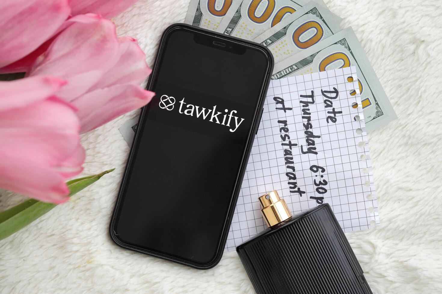 KYIV, UKRAINE - FEBRUARY 23, 2024 Tawkify logo of famous dating website or app on iPhone display photo