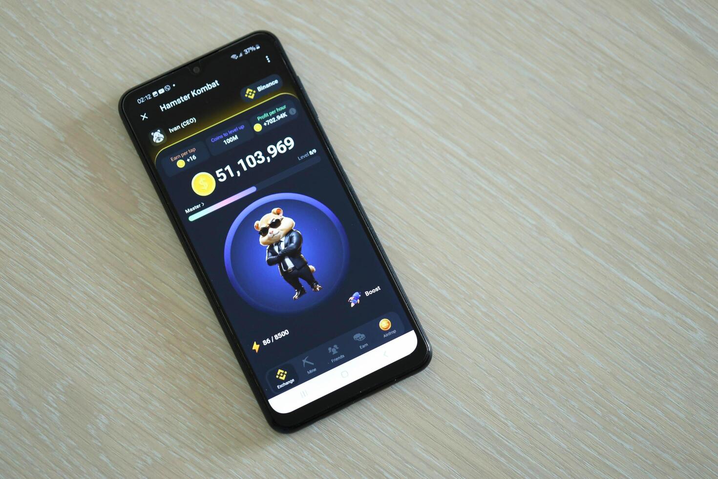 KYIV, UKRAINE - APRIL 20, 2024 Hamster Kombat telegram bot on smartphone screen. Hamster Kombat is a viral Telegram crypto game for earn HMSTR tokens by managing virtual crypto exchange photo