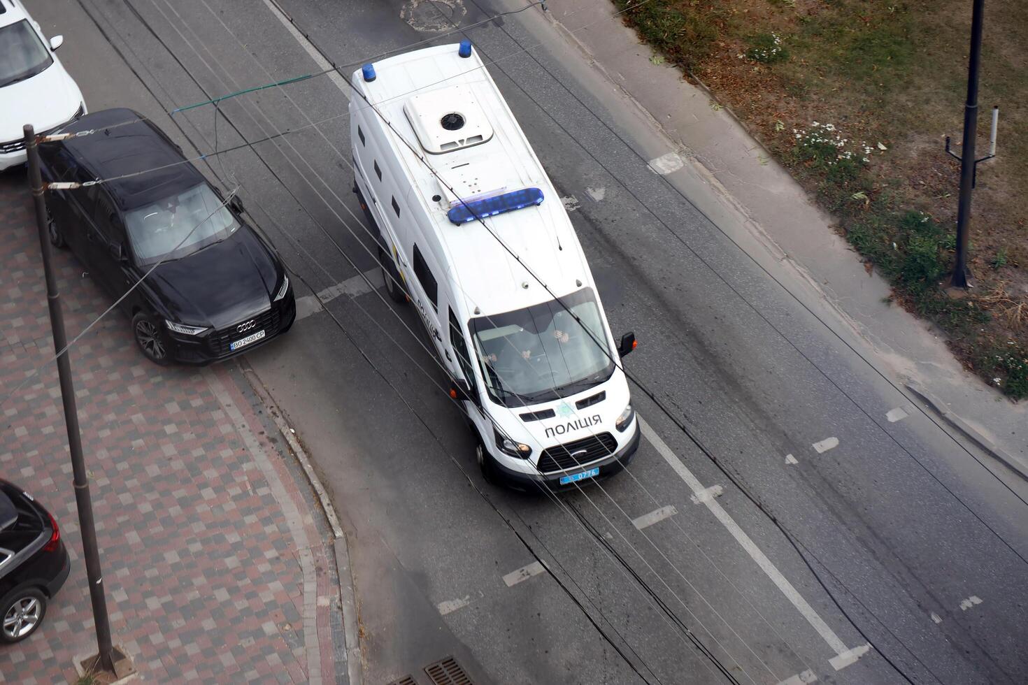 TERNOPIL, UKRAINE - JULY 7, 2023 Ukrainian patrol police white car with police lights and decals in daytime photo