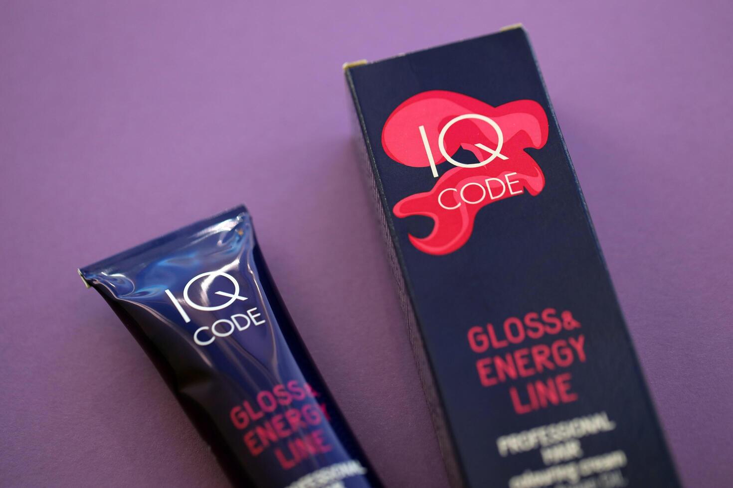 KYIV, UKRAINE - OCTOBER 31, 2023 Tube of IQ Code Gloss and Energy Line colorizer cream for hair photo
