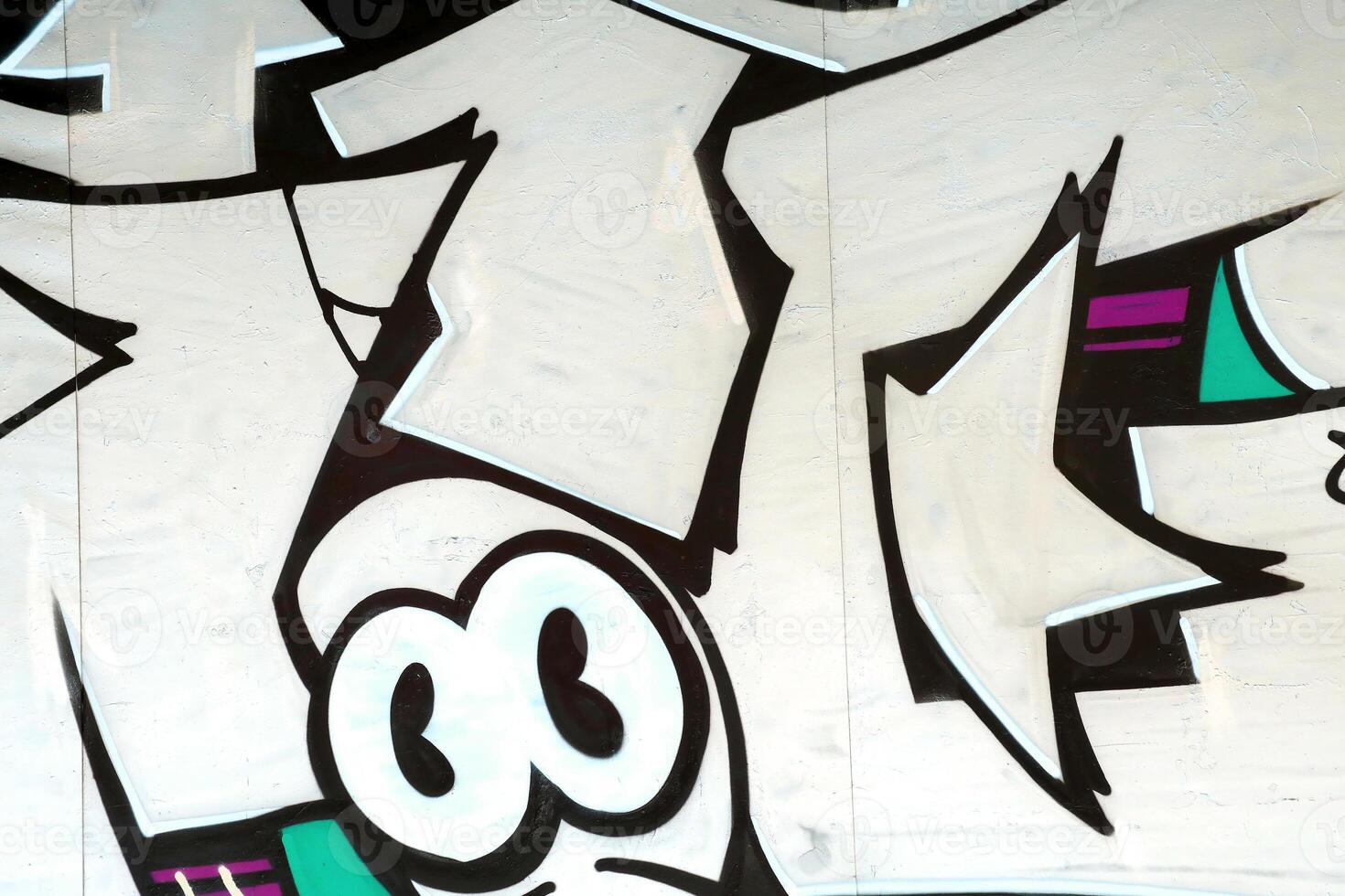 Colorful background of graffiti painting artwork with bright aerosol outlines on wall. Old school street art piece made with aerosol spray paint cans. Contemporary youth culture photo