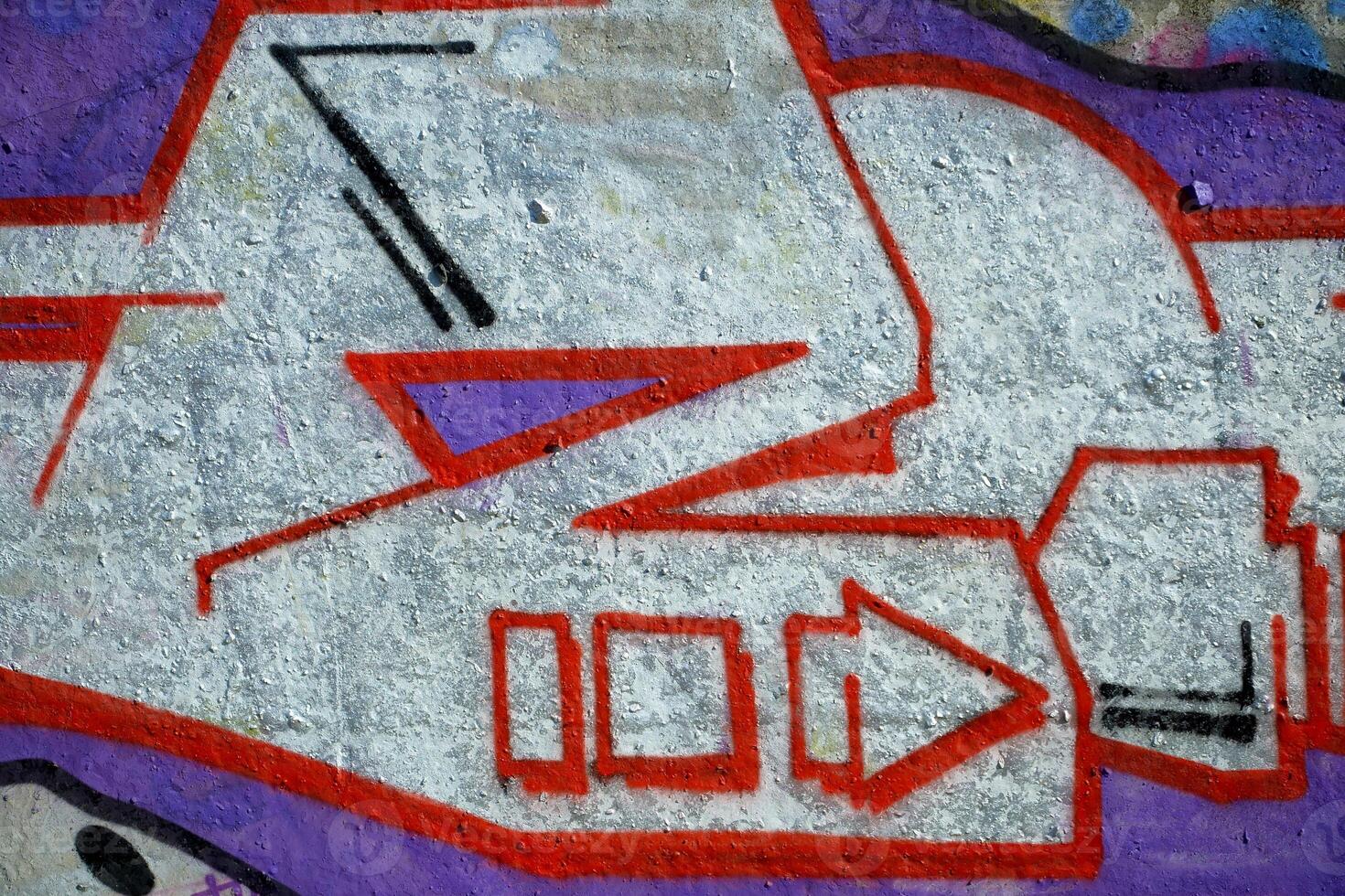Colorful background of graffiti painting artwork with bright aerosol outlines on wall. Old school street art piece made with aerosol spray paint cans. Contemporary youth culture photo