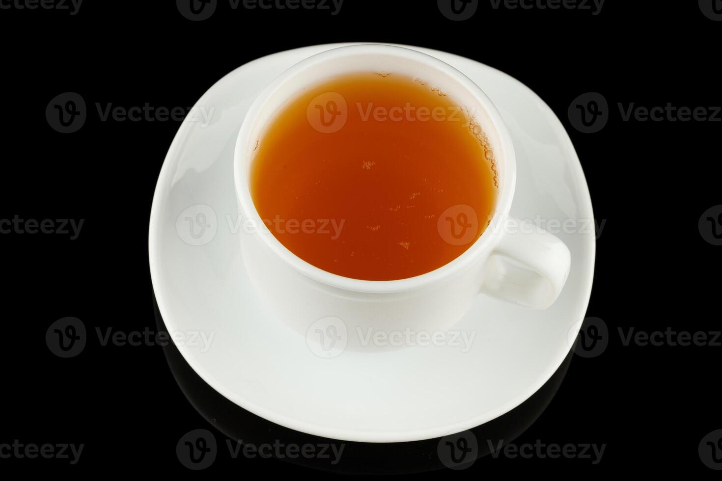 Green tea in a cup on a black background photo