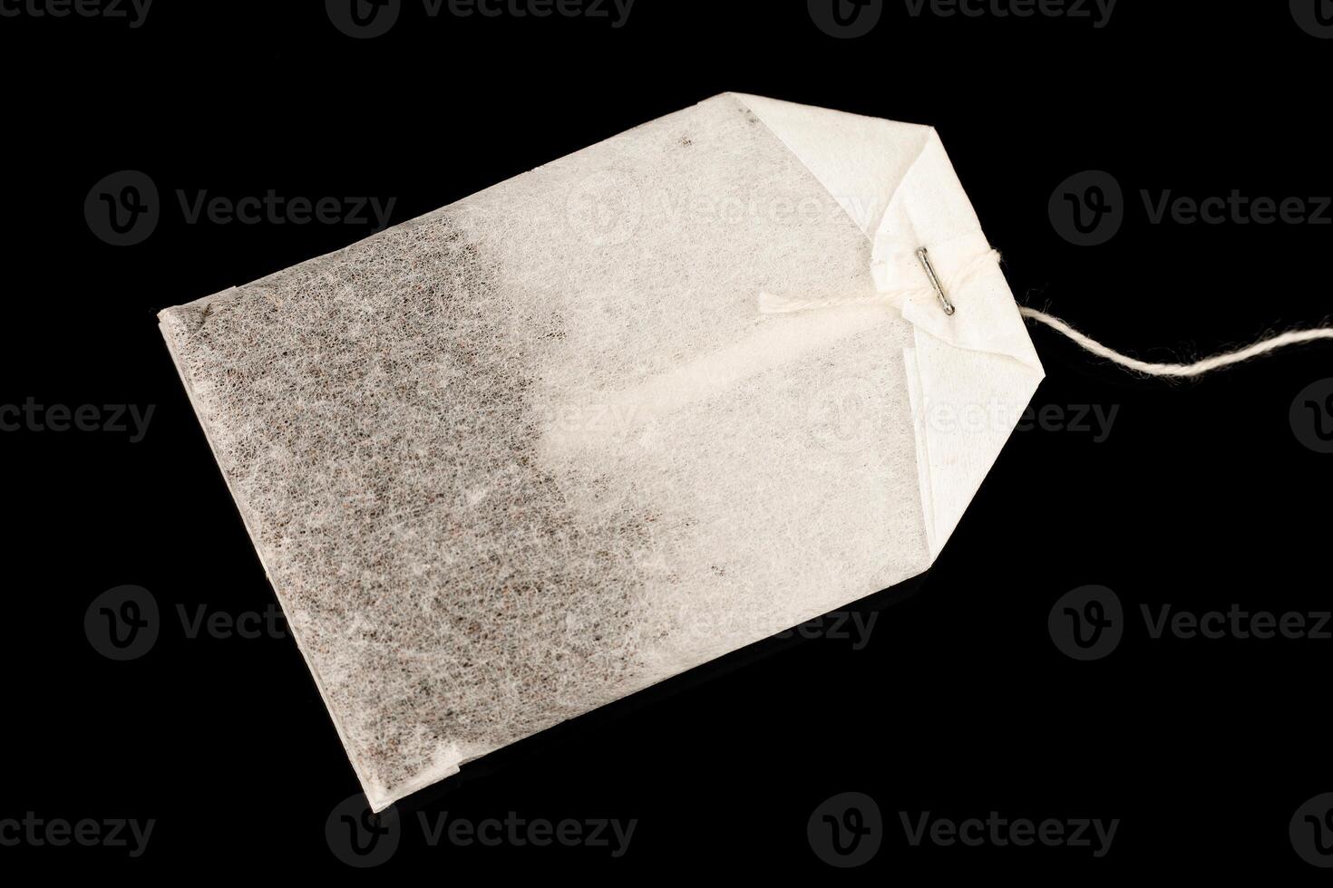 A bag of tea is new black background photo