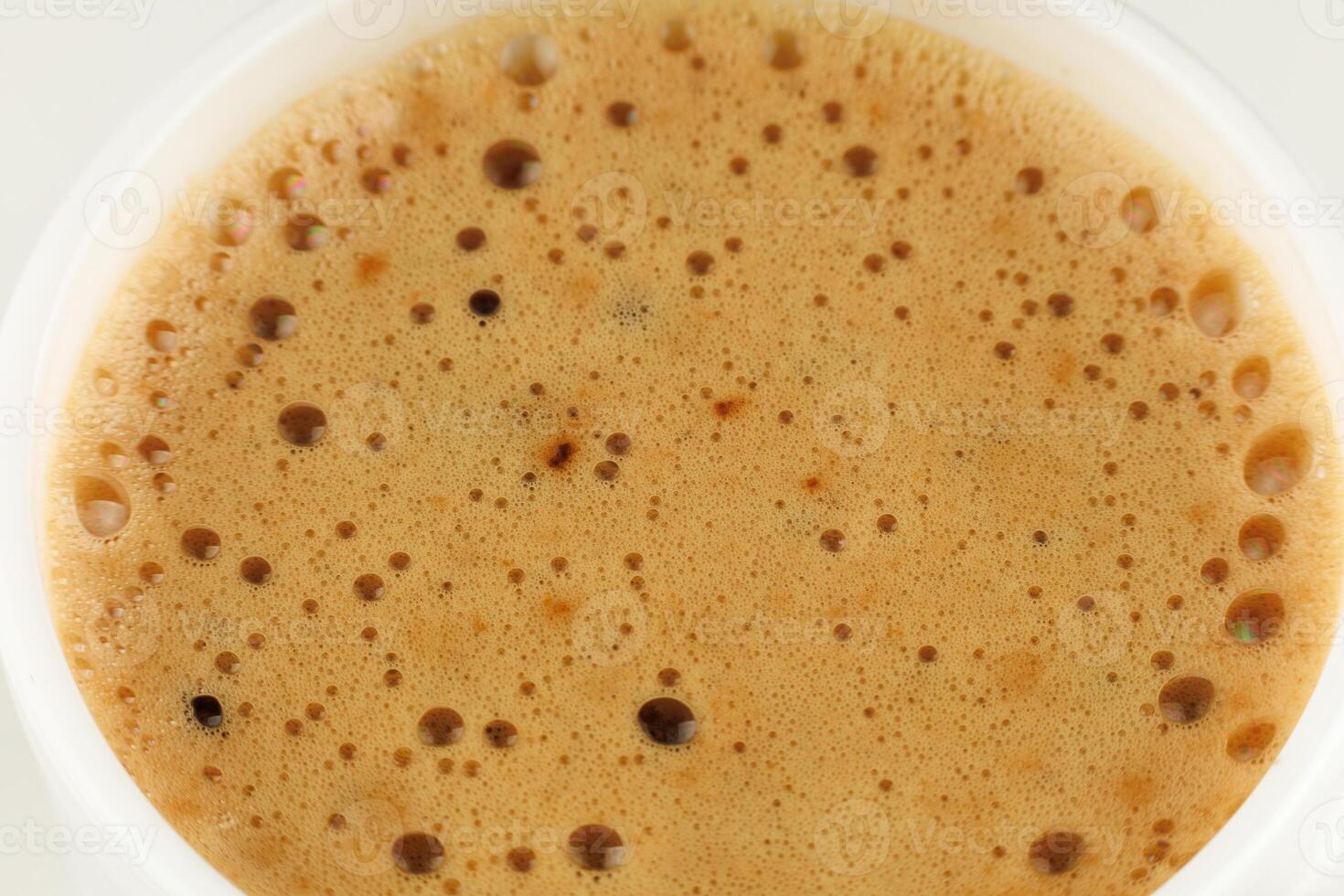 Mokka coffee drink with foam in a white cup photo